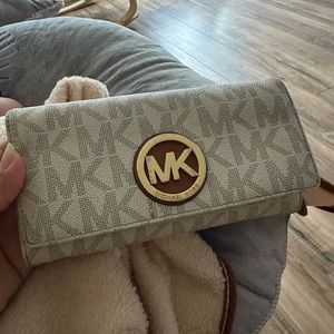 Used Michael kors tan and gold wallet